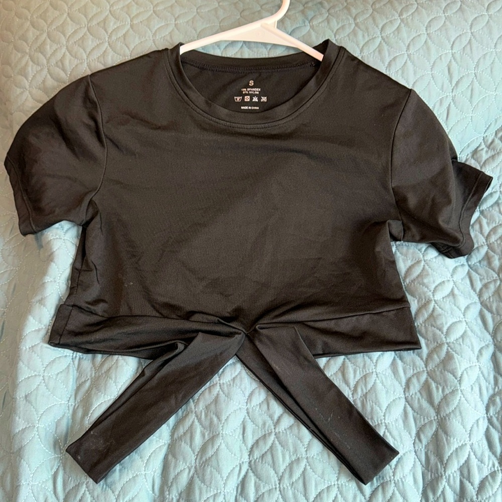 NVGTN Collection Black Crop Top in Sz Small. Cute detailing on bottom of top.